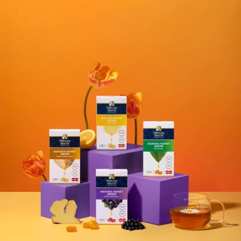 Person dissolving a Manuka Health lemon honey drop to soothe throat naturally